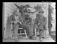 [Untitled photo, possibly related to: Farmer and son, members of the Boundary Farms, FSA (Farm Security Administration) project. Boundary County, Idaho] by Russell Lee
