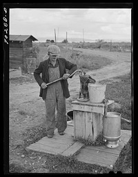 Water from this well is used for household and stock. FSA (Farm Security Administration) rehabilitation borrower who rents from Indian. Yakima County, Washington by Russell Lee
