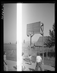 [Untitled photo, possibly related to: Basketball game. Children living at the FSA (Farm Security Administration) mobile camp for migratory farm workers. Odell, Oregon] by Russell Lee