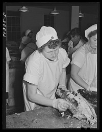 Skinning cooked tuna before canning. Columbia River Packing Association, Astoria, Oregon by Russell Lee