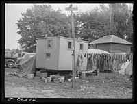 Detail of trailer camps. Hermiston, Oregon. Workmen at Umatilla ordnance are paying eight dollars per month to park their trailers in this court by Russell Lee