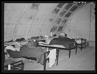 Housing conditions have been so acute at Hermiston, Oregon, that authorities at the Umatilla ordnance depot have experimentally converted some igloos into housing quarters. Satisfactory comment has been received from single workmen so housed by Russell Lee