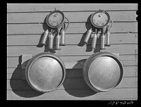 Mechanical milking apparatus on farm in Black Canyon Project. Canyon County, Idaho by Russell Lee