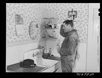 Lee Wagoner, farmer on Black Canyon Project, washes up for dinner. Canyon County, Idaho by Russell Lee