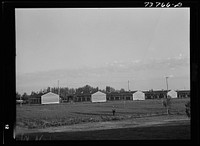 Twin Falls, Idaho. FSA (Farm Security Administration) farm workers' camp. Row shelters in which the Japanese live by Russell Lee