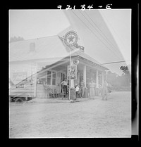 [Untitled photo, possibly related to: Rural filling station becomes community center and general grounds for loafing. The men in baseball suits are on a local team which will play a game nearby. The team is called the Cedargrove Team. Fourth of July, Near Chapel Hill, North Carolina]. Sourced from the Library of Congress.