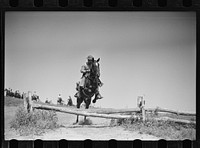 Fort Riley, Kansas. Soldiers of a cavalry machine gun platoon going over an obstacle during a field problem. Sourced from the Library of Congress.