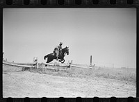 Fort Riley, Kansas. Soldiers of a cavalry machine gun platoon going over an obstacle during a field problem. Sourced from the Library of Congress.