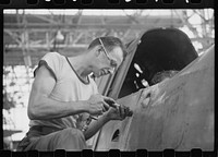 Nashville, Tennessee. Vultee Aircraft Company. Riveting a fuselage on a sub-assembly line. Sourced from the Library of Congress.