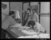 Final inspection of pilot parachutes at the Pacific Parachute Company. San Diego, California by Russell Lee