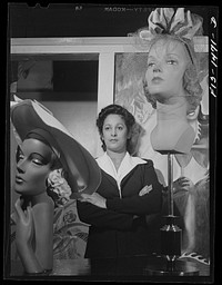 Miss Selma Barbour, manager of the Cecilian Specialty Hat Shop, 454 East 47th Street. Miss Barbour has been managing this store for one year, and has been in business for four years. She was born in New Orleans, and has eight brothers, seven of whom are eligible for the Army. Chicago, Illinois. Sourced from the Library of Congress.