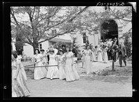 Leaving church after mass at the Portuguese-American Festival of the Holy Ghost. Novato, California by Russell Lee