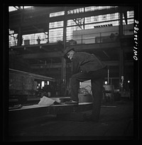 [Untitled photo, possibly related to: Chicago, Illinois. Workmen studying blueprints in the Chicago and Northwestern Railroad repair shops]. Sourced from the Library of Congress.