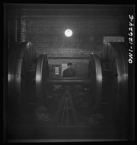 [Untitled photo, possibly related to: Chicago, Illinois. Refacing tires on locomotive's wheels at a Chicago and Northwestern Railroad shop]. Sourced from the Library of Congress.