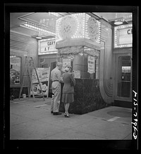 [Untitled photo, possibly related to: Washington, D.C. Sergeant George Camblair taking his girlfriend to the movies while he is at home on a weekend furlough]. Sourced from the Library of Congress.
