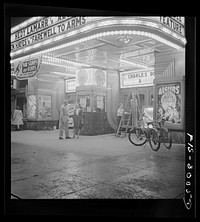 [Untitled photo, possibly related to: Washington, D.C. Sergeant George Camblair taking his girlfriend to the movies while he is at home on a weekend furlough]. Sourced from the Library of Congress.