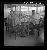 [Untitled photo, possibly related to: Big Hole Valley, Beaverhead County, Montana. Ranchers and cattle buyers eating dinner at ranch. Buyers from the middle west come out to the ranches in the fall to select feeder cattle] by Russell Lee
