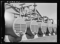 Butte, Montana. Anaconda Copper Mining Company. Air compressor tanks at mountain con copper mine by Russell Lee