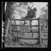 Fort Belvoir, Virginia. Sergeant George Camblair getting rigorous physical training on the obstacle course. Sourced from the Library of Congress.