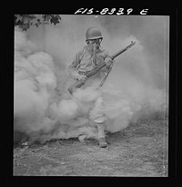 Fort Belvoir, Virginia. Sergeant George Camblair learning how to use a gas mask in a practice smokescreen. Sourced from the Library of Congress.