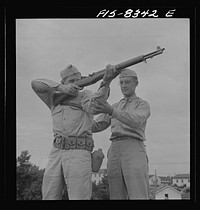 Fort Belvoir, Virginia. Sergeant George Camblair getting instruction on the rifle range. Sourced from the Library of Congress.