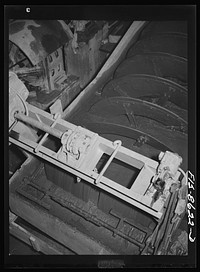 Anaconda smelter, Montana. Anaconda Copper Mining Company. Classifier which removes the slimy material from the granular material after it has passed through the ballmills; the slimy material is removed and the granular material returns to ballmill for more grinding by Russell Lee