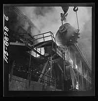 Anaconda smelter, Montana. Anaconda Copper Mining Company. Returning the first slag from the converter to the reverberatory furnace. The first few ladles of slag always contain some copper, and to redeem this copper the slag is returned to the furnace by Russell Lee