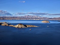 Aerial view of a portion the water and surroundings of Lake Mead, created by the construction of nearby Hoover Dam, which straddles the Arizona-Nevada border.