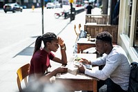 Couple reading the menu at a cafe