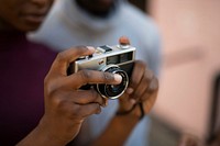 Woman using an analog film camera