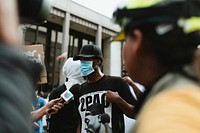 Protester being interviewed by a news channel during the Black Lives Matter protest at Hollywood &amp; Vine. 2 JUN, 2020, LOS ANGELES, USA