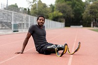 Paralympic athlete relaxing by the running track 