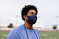 Male athlete wearing mask in the new normal 