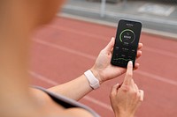 Phone screen psd with activity tracker being used by a woman