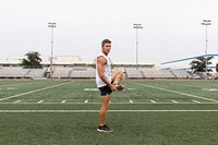 Man warming up by stretching before exercise