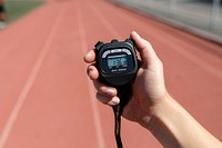 Hand holding stopwatch