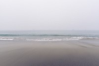 Sandy shore, clear sky, beach, ocean waves, free public domain CC0 photo.