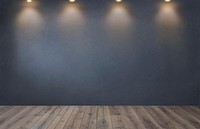 Dark gray wall with a row of spotlights in an empty room