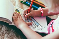 Free child drawing with pencil notepad color image, public domain people CC0 photo.