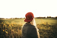 Free woman red hat in field photo, free public domain CC0 image.
