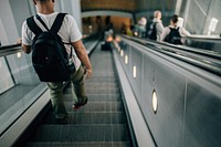 Free person riding down escalator photo, free public domain CC0 image.