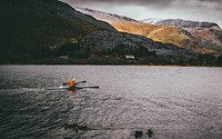 Free person kayaking with mountain view image, public domain CC0 photo.