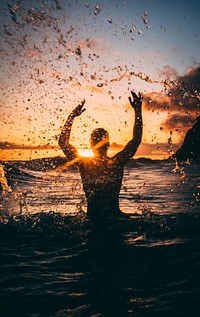 Man Splashing Water Sunset 