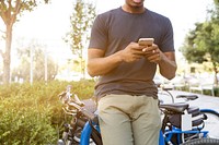 Free man leaning against a cycle image, public domain communication CC0 photo.