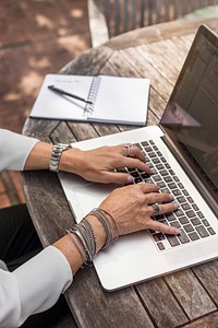 Woman working on laptop, free public domain CC0 photo.