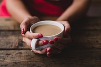 Free handing holding a cup of coffee photo, public domain drink CC0 image.