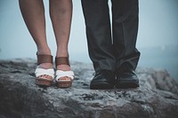 Free couple standing on rock image, public domain CC0 photo.