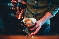 Free barista pouring coffee photo, public domain beverage CC0 image.