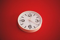 Free clock on red background photo, public domain time CC0 image.