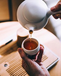 Free hands pouring tea photo, public domain beverage CC0 image.